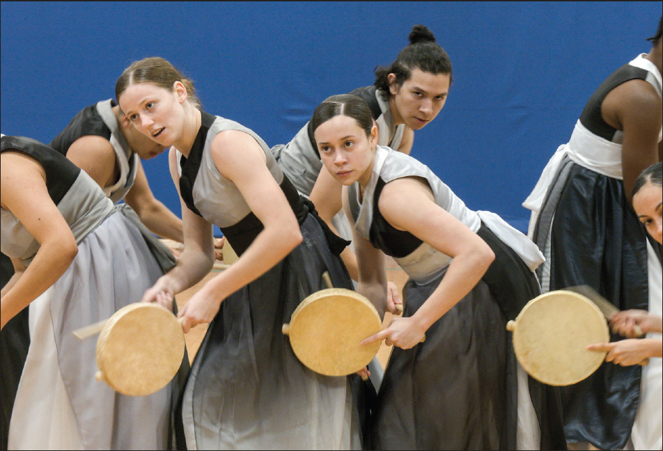 NE Movers Unlimited finish their peformance with drums as they rehearse for the Fort Worth Dance Festival.